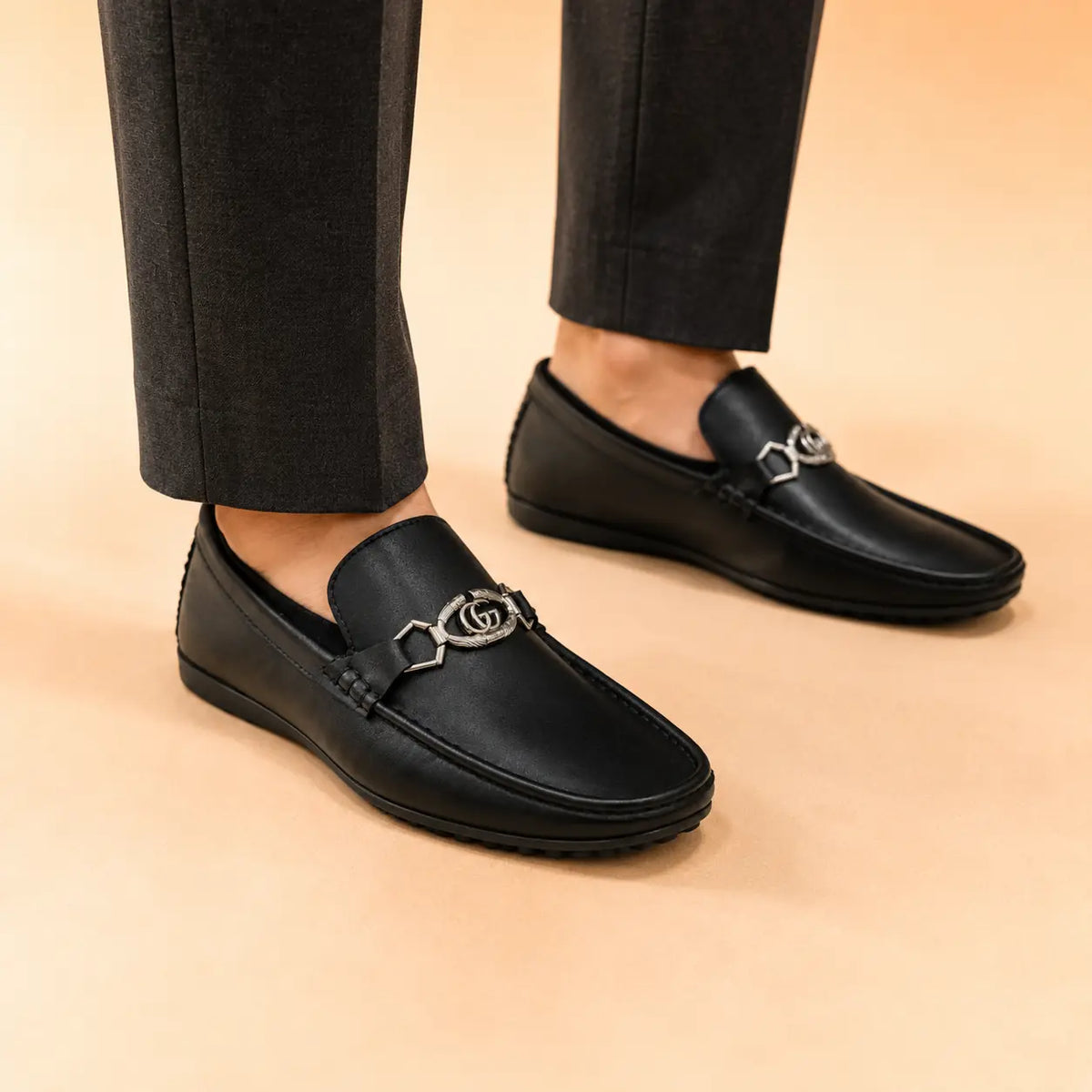 Regal Crest black leather loafers worn with formal trousers